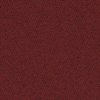 Red fabric texture sample, granular surface, matte finish, col. 64203, densely packed particles, uneven and warm tactile quality.